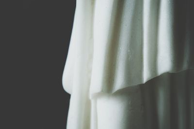 Close-up of curtain against black background