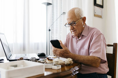 Man sitting on table at home