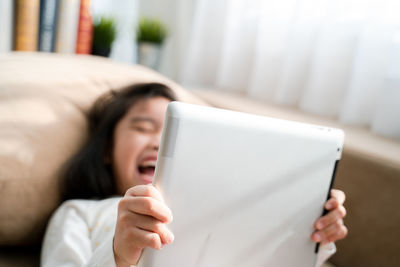 Midsection of man using mobile phone