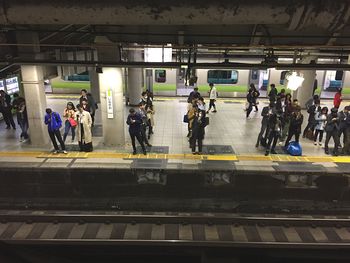 People on railroad station platform