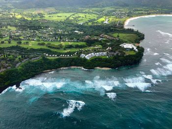 Aerial view of sea by landscape