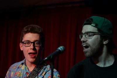 Men singing in music concert