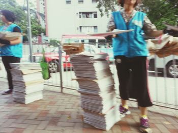 Woman walking on street in city