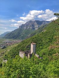 Scenic view of green mountains against sky