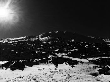 Low angle view of snow on mountain against sky