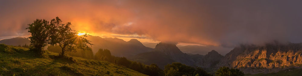 Scenic view of mountains against sky during sunset