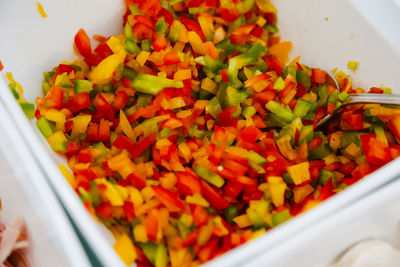 High angle view of chopped bell peppers in container