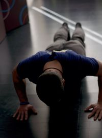 High angle view of man relaxing on floor at home