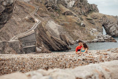 Woman sitting on rock