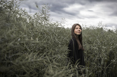 Young woman looking away outdoors