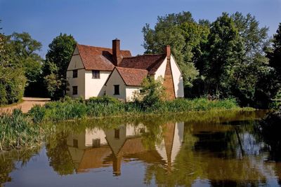 Reflection of trees and building in lake