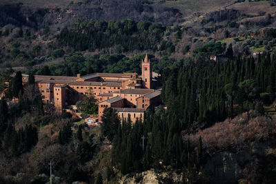 Panoramic view of trees and buildings against sky