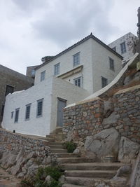 Low angle view of stone wall against sky