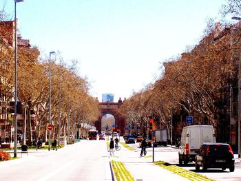 Vehicles on road along buildings