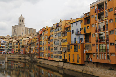 Residential buildings against sky in city