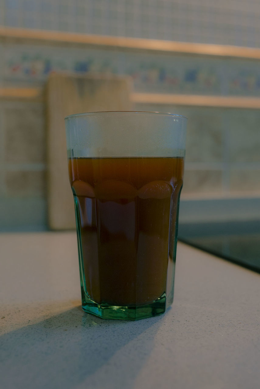 CLOSE-UP OF GLASS OF JUICE