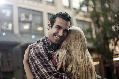 Portrait of smiling young man outdoors