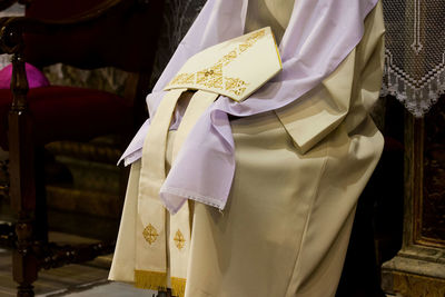 Close-up of religious costume in church