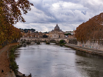 View of bridge over river against cloudy sky