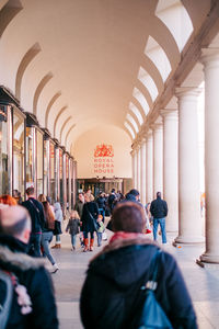 People in corridor of building