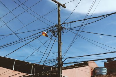 Low angle view of cables against sky