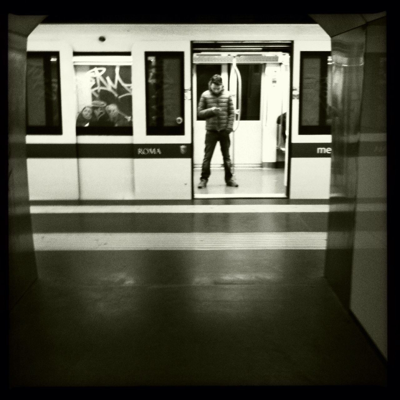 FULL LENGTH OF MAN AND WOMAN IN ILLUMINATED UNDERGROUND