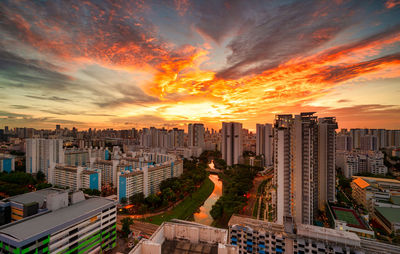 High angle view of buildings against sky during sunset