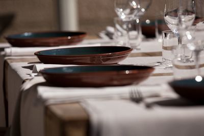 Close-up of empty glasses on table