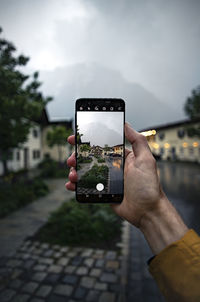 Man photographing using smart phone