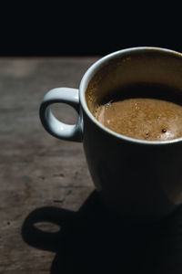 Close-up of coffee cup on table