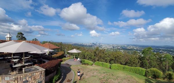 High angle view of buildings and trees against sky