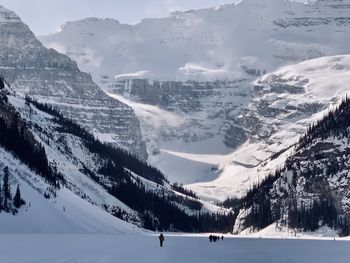 Scenic view of snow covered mountains against sky