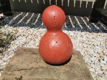 High angle view of red stones on pebbles