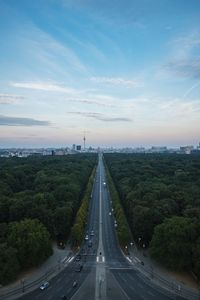 Street amidst tiergarten against sky