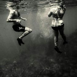 Woman jumping in water