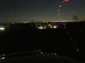 Low angle view of illuminated sky at night