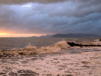 Scenic view of sea against dramatic sky