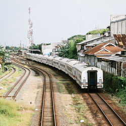 Train in city against clear sky