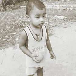 Boy standing outdoors