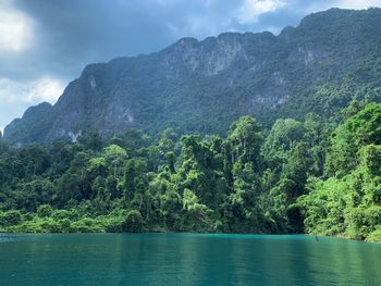 Scenic view of lake and mountains against sky