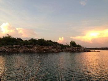 Scenic view of landscape against sky during sunset