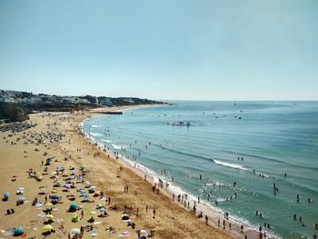 High angle view of people on beach against sky
