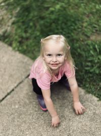 Portrait of cute girl playing on field