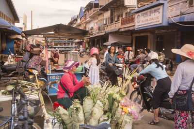 People at market in city