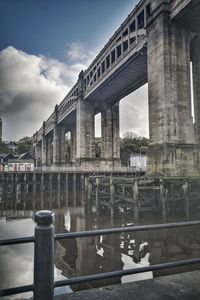 View of bridge against cloudy sky