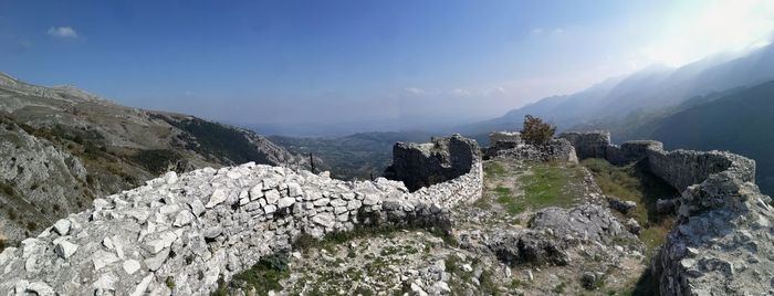 Panoramic view of rocky mountains against sky