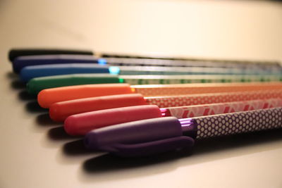 Close-up of multi colored pencils on table