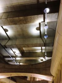 Low angle view of illuminated pendant light hanging from ceiling