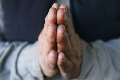 Close-up of hands praying