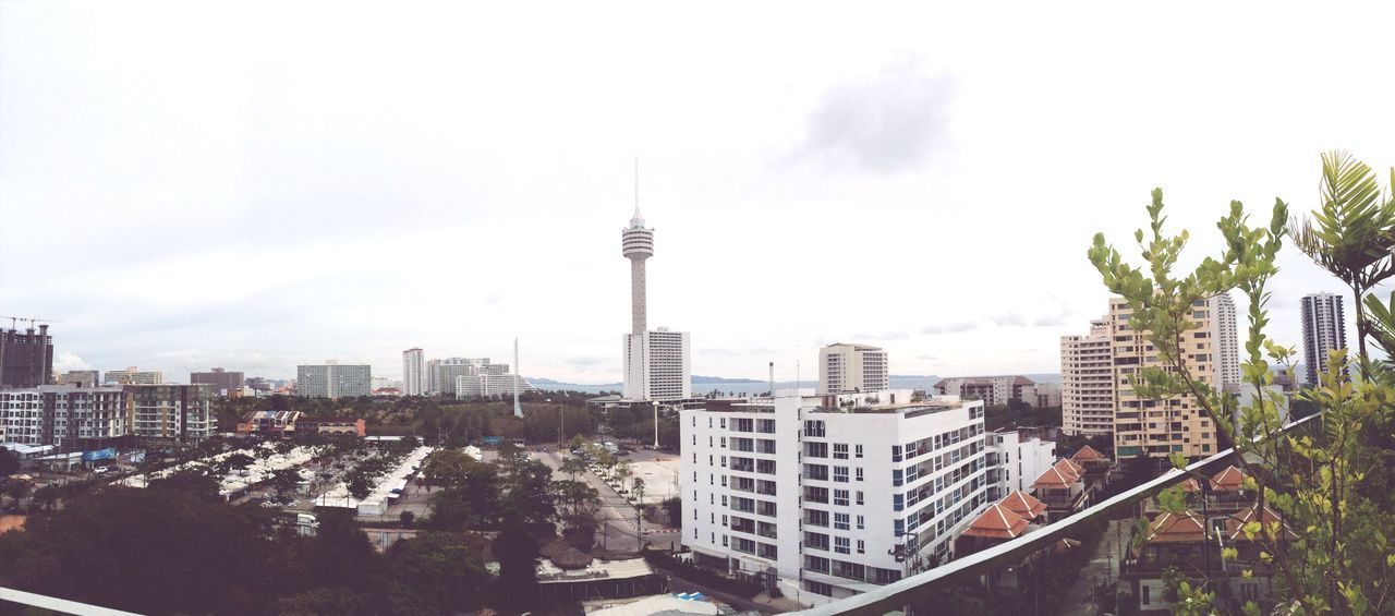 building exterior, architecture, built structure, city, tower, tall - high, cityscape, skyscraper, sky, capital cities, office building, modern, travel destinations, city life, high angle view, famous place, crowded, spire, residential district, residential building